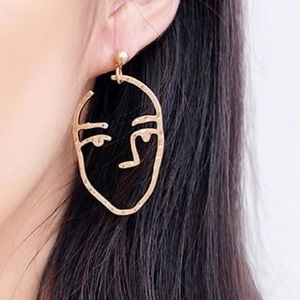 Anthropologie face Silhouette earrings